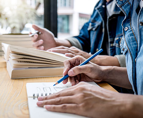 Healthcare professionals studying and taking notes